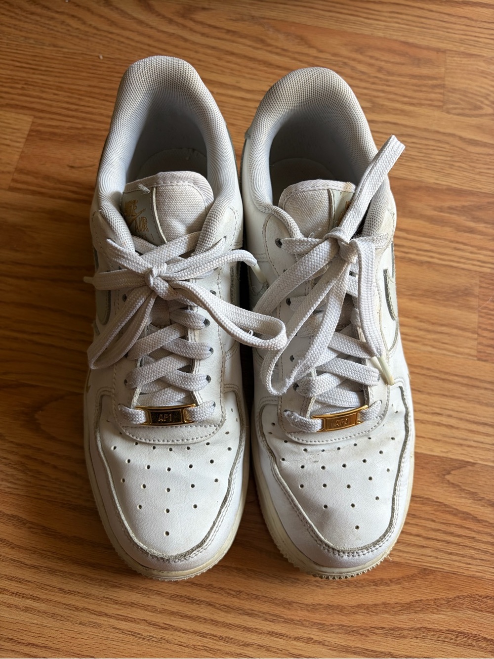 Nike Women's White High-Top Sneakers with Gold Accents